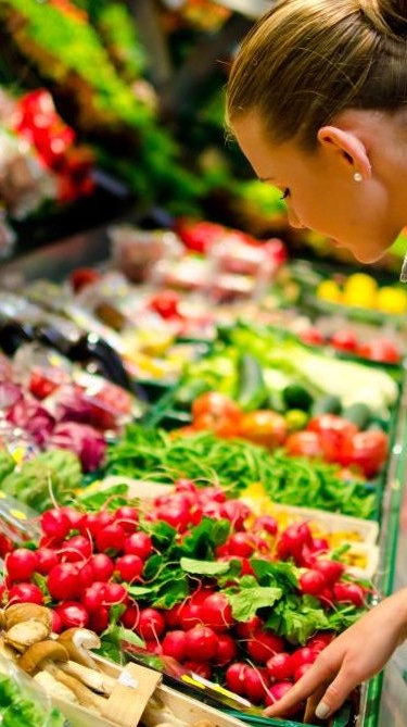 Woman in a supermarket doing grocery shopping